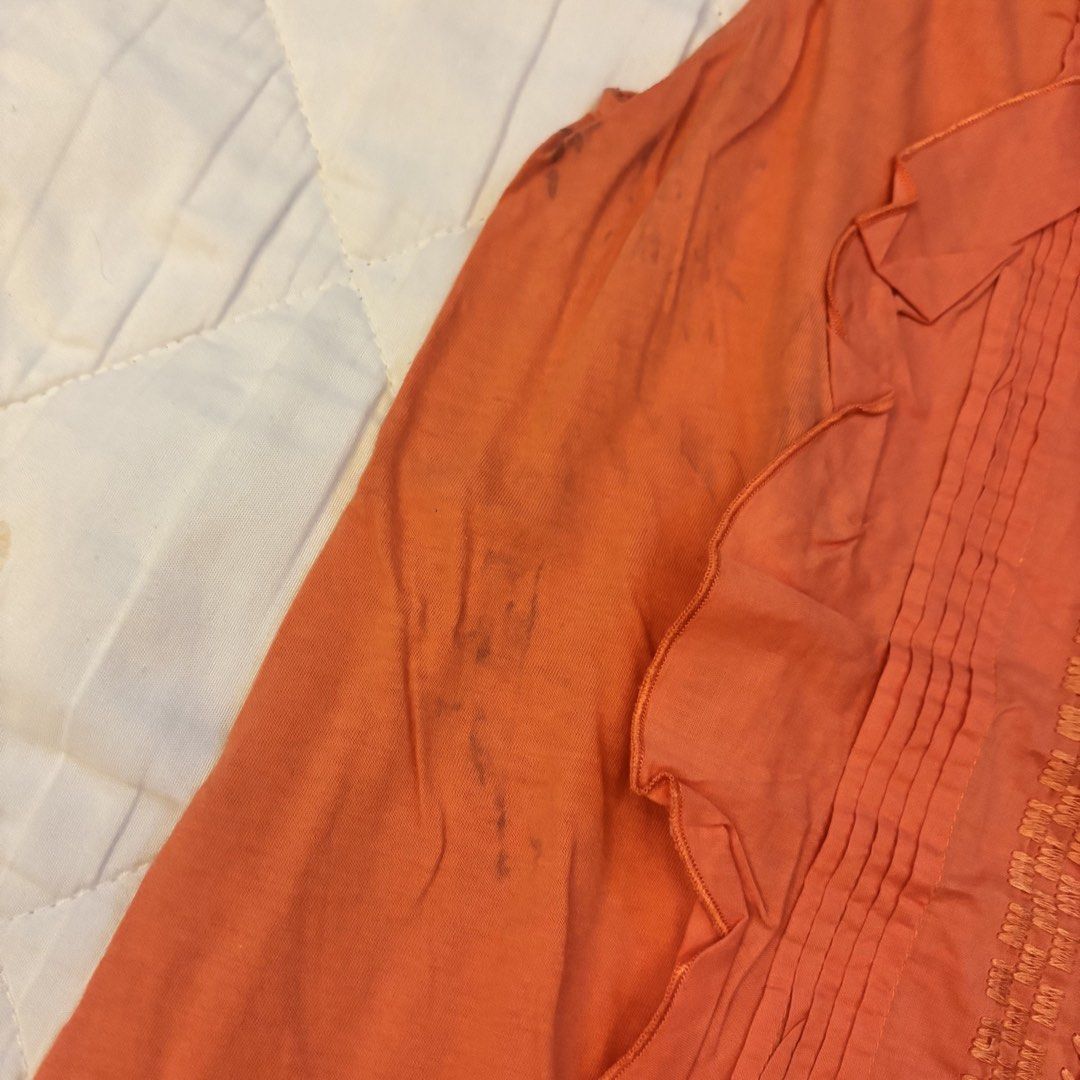 Massimo Dutti Orange Sleeveless Ruffled Embroidered Top (Category: Sleeveless) located in Angono. Submitted by andyyyyyy__ (Listing ID 1448183225, Image 3). Description: - Orange sleeveless top - Brand: Massimo Dutti - Features: Ruffles on sides, embroidered panel on front - Closure: Keyhole at back neck - Condition: Minor dark marks on front left side (as pictured) - Style: Great for casual wear.