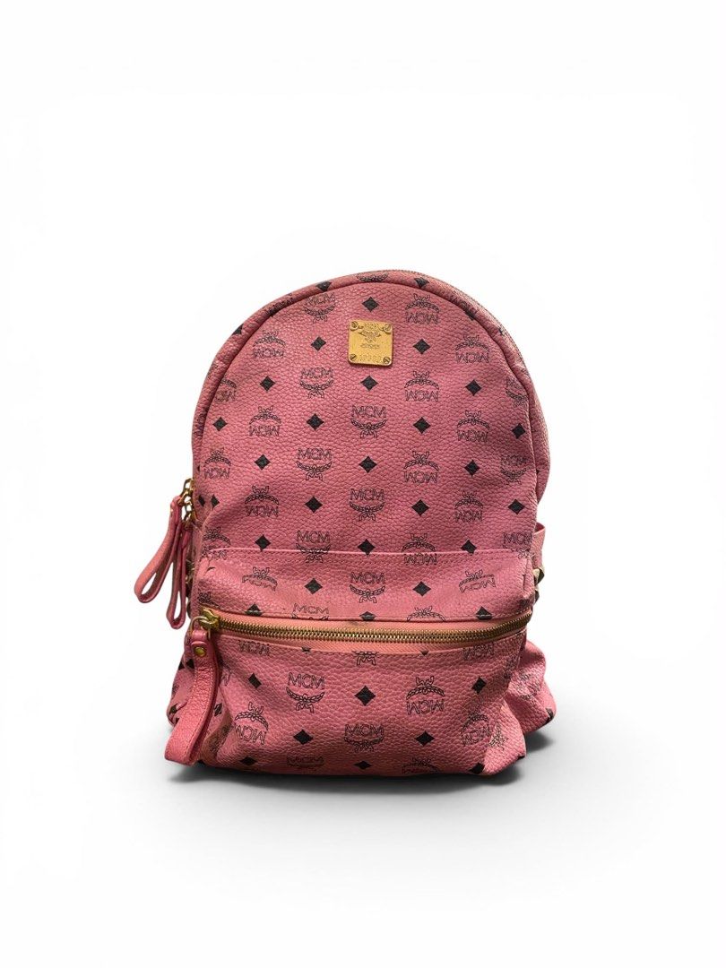 MCM Stark Side Stud Visetos Pink Backpack (Category: Luxury Bags & Wallets) located in Cagayan de Oro. Submitted by timeless.ph (Listing ID 1448260345, Image 1). Description: Size: Medium Width: 13.5” with Laptop Compartment Length: 11” Condition: Rank AB Issue/s: minor rubber lining & stain (need wash) & rubs *color may vary due to lighting*.