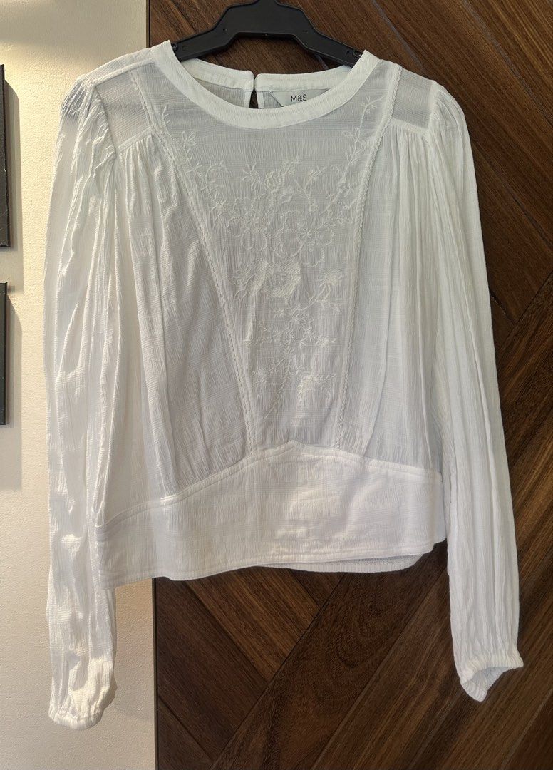 M&S White Embroidered Long Sleeve Blouse Size 8 (Category: Blouses) located in Manila. Submitted by cynchferrer (Listing ID 1448123692, Image 1). Description: - M&S White Long Sleeve Blouse - Size: 8 - Delicate embroidery on the front - Smocked hem and cuffs for a comfortable fit - Button closure at the back neck - Worn once .