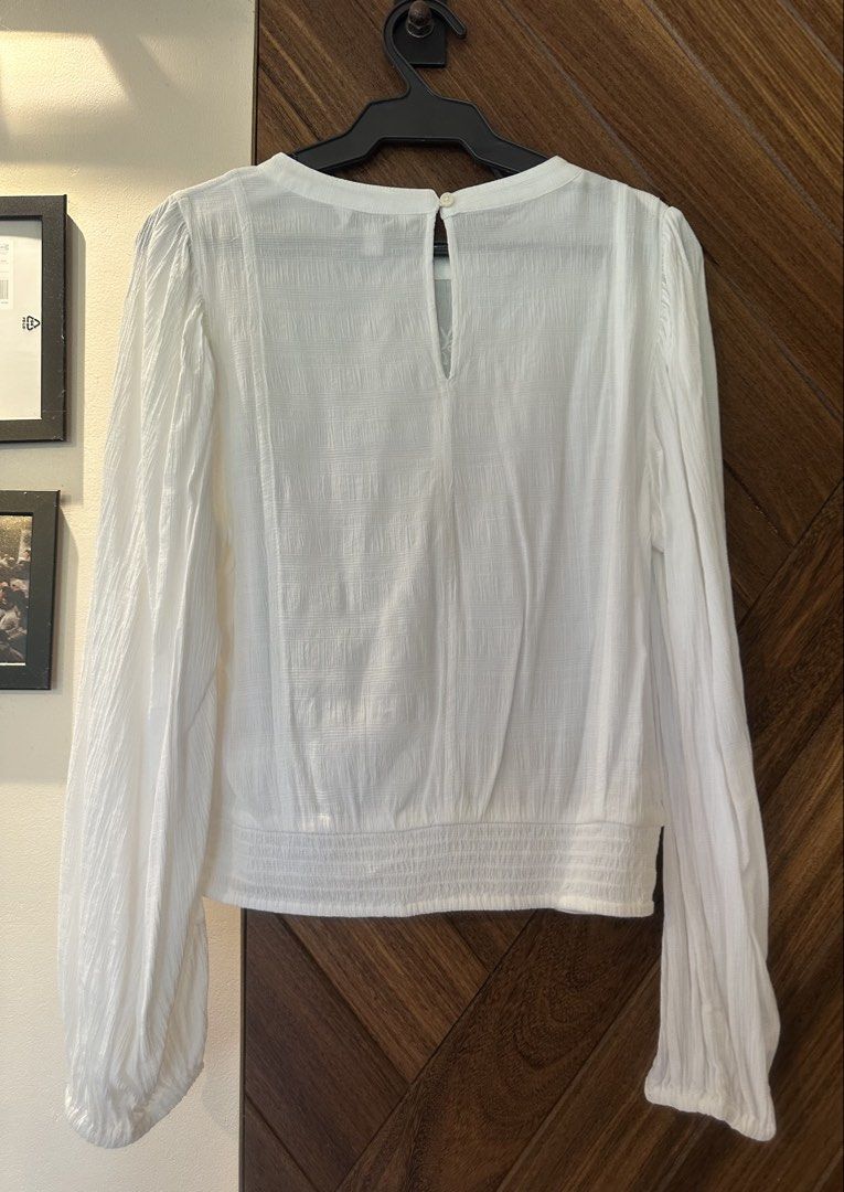 M&S White Embroidered Long Sleeve Blouse Size 8 (Category: Blouses) located in Manila. Submitted by cynchferrer (Listing ID 1448123692, Image 2). Description: - M&S White Long Sleeve Blouse - Size: 8 - Delicate embroidery on the front - Smocked hem and cuffs for a comfortable fit - Button closure at the back neck - Worn once .