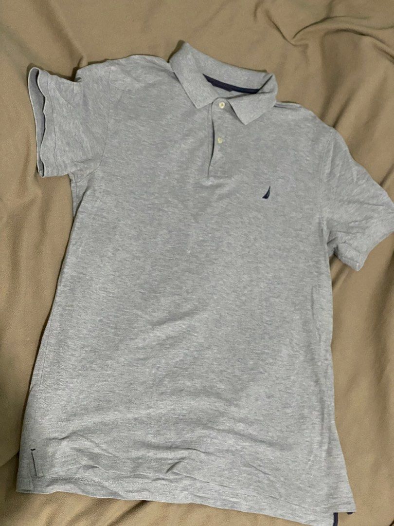 Nautica Grey Polo Shirt (Category: Tshirts & Polo Shirts ) located in Cebu City. Submitted by bred_bt (Listing ID 1448222024, Image 1). Description: - Brand: Nautica - Color: Grey - Style: Polo Shirt - Sleeves: Short - Features: Collared, small chest logo - Material: 100% Cotton - Size: 21x29.