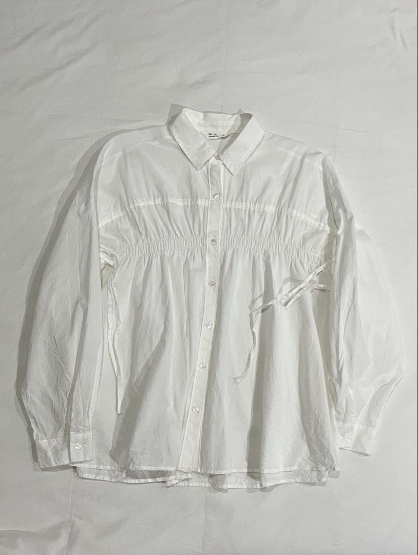 NET Button-Up Shirt with Gathered Detail (Category: Longsleeves) located in Rizal. Submitted by hansio (Listing ID 1448232542, Image 1). Description: 🎐 Details • Never worn • Adjustable bust and sleeves • Color: White • Size: Small • Bought for: ~P1,050 from Taiwan 📏 Measurements • Length (front): ~63cm • Length (back): ~66cm • Sleeves (from collar): ~68cm • Bust: ~47cm RFS: Was going to wear this for an event but found a better outfit MOP: E-w