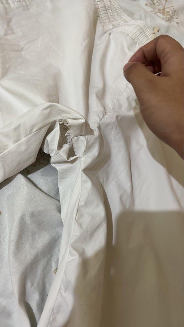Nike White Track Pants with Zips (Category: Joggers) located in Tabuk. Submitted by iinnkk (Listing ID 1445632932, Image 3). Description: - Flaws seen last pic - White Nike track pants - Black accents on sides - Ankle zips for easy on/off - Comfortable elastic waistband - Size XL - Ideal for workouts or casual wear.