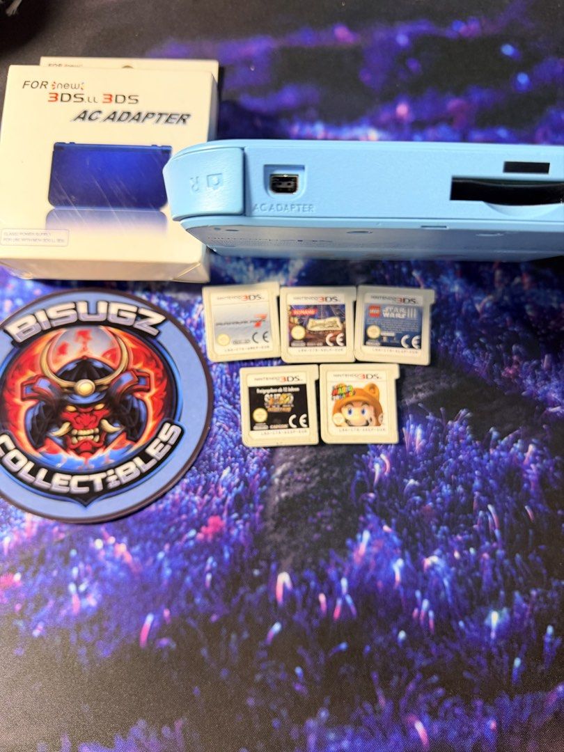 Nintendo New 3DS LL AC Adapter & 5 Games Bundle (Category: Nintendo) located in Manila. Submitted by bisugz.collectibles (Listing ID 1448106783, Image 3). Description: RARE! Nintendo 2DS Pokemon Edition with Gamecarts Bundle - 5 Gamecarts Included - 220v Charger - Good Screens No issues - All Buttons Working , Loud Volumes - Stylus Included Bundle Price: 9,890 - Light blue Nintendo New 3DS LL - Includes original AC adapter and box - 5 Games inclu