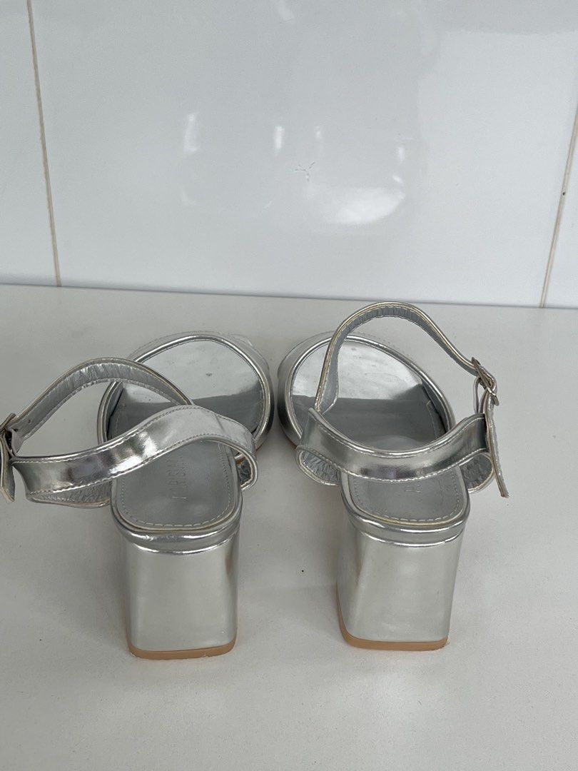PARISIAN Silver Block Heel Sandals Size 7 (Category: Flats & Sandals) located in Naga. Submitted by ajmaq (Listing ID 1448143831, Image 3). Description: - Brand: PARISIAN -size:7 -used once only - Color: Silver - Style: Block heel sandals - Toe shape: Square toe - Features: Ankle strap - Heel height: Approximately 2 inches - Condition: Uppers are clean - Versatility: Perfect for dressing up or down.