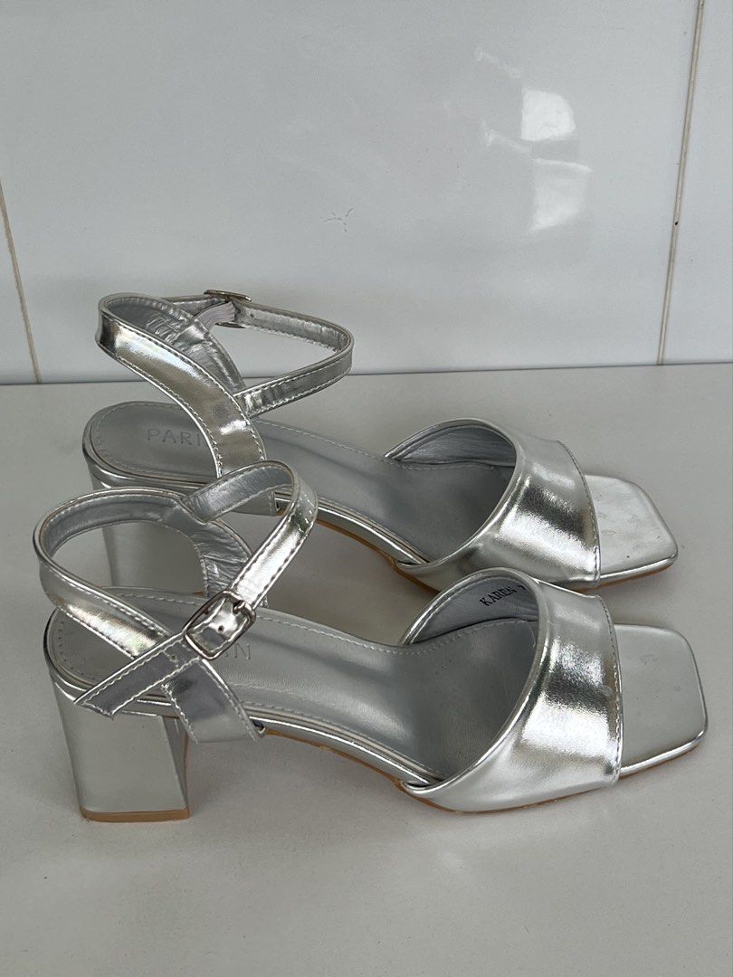 PARISIAN Silver Block Heel Sandals Size 7 (Category: Flats & Sandals) located in Naga. Submitted by ajmaq (Listing ID 1448143831, Image 2). Description: - Brand: PARISIAN -size:7 -used once only - Color: Silver - Style: Block heel sandals - Toe shape: Square toe - Features: Ankle strap - Heel height: Approximately 2 inches - Condition: Uppers are clean - Versatility: Perfect for dressing up or down.