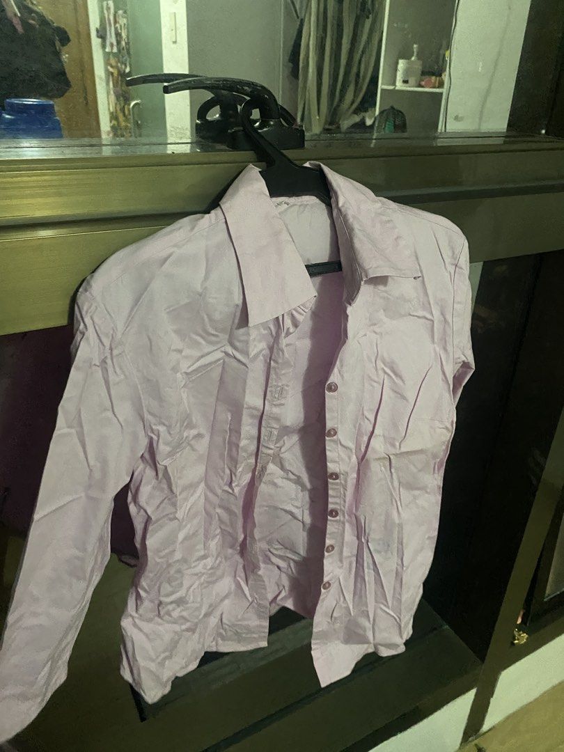 Pink Button-Up Long Sleeve Shirt (Category: Longsleeves) located in Taguig. Submitted by aerish_declutter (Listing ID 1448080835, Image 1). Description: - Classic pink button-up shirt - Long sleeves with button cuffs - Collared neckline - Standard fit - Versatile for casual or work attire.
