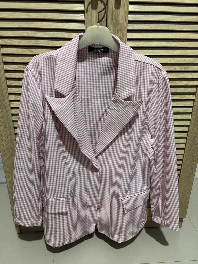 Pink Gingham Blazer (Category: Coats, Jackets and Outerwear) located in Angeles City. Submitted by declutterwithus (Listing ID 1448214916, Image 1). Description: - Adorable pink gingham pattern - Single button closure for a clean look - Two functional front pockets - Versatile for layering over tops or dresses - Ideal for casual to smart-casual outfits - Effortless to style for any occasion.