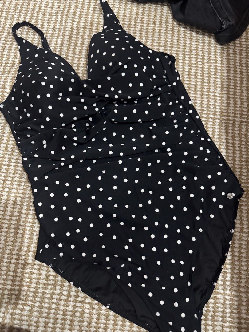 Plus Size Black Polka Dot One-Piece Swimsuit (Category: Bikinis & Swimsuits) located in Valenzuela. Submitted by cutratemnl (Listing ID 1448195789, Image 2). Description: - Classic black one-piece swimsuit - All-over white polka dot pattern - Flattering ruched detailing on the front - Adjustable straps for a custom fit - Ideal for beach or pool outings.