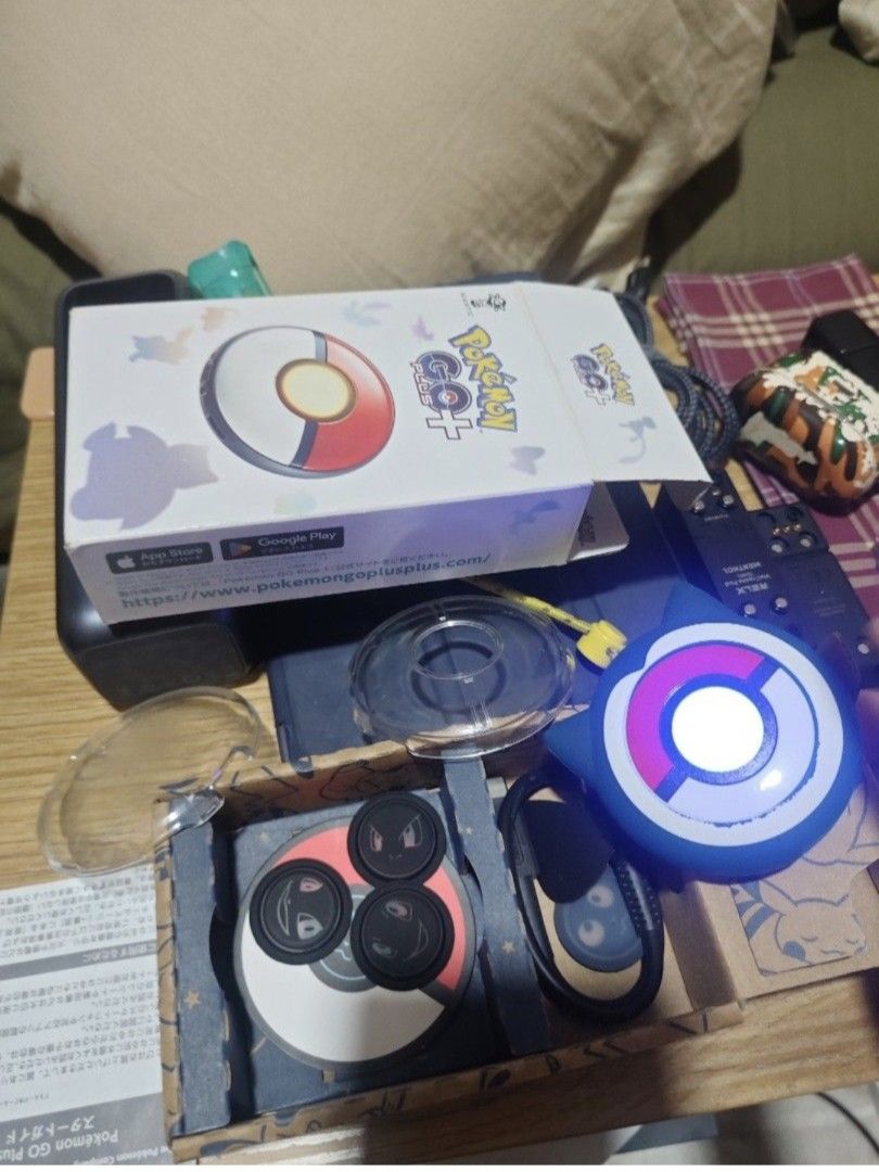 Pokemon Go Plus Device with Accessories (Category: Nintendo) located in Manila. Submitted by zeus025 (Listing ID 1448203843, Image 1). Description: - Pokemon Go Plus device - Includes original box - Comes with charging cable - Extra lens covers included - Connects to your phone for seamless Pokemon Go gameplay.