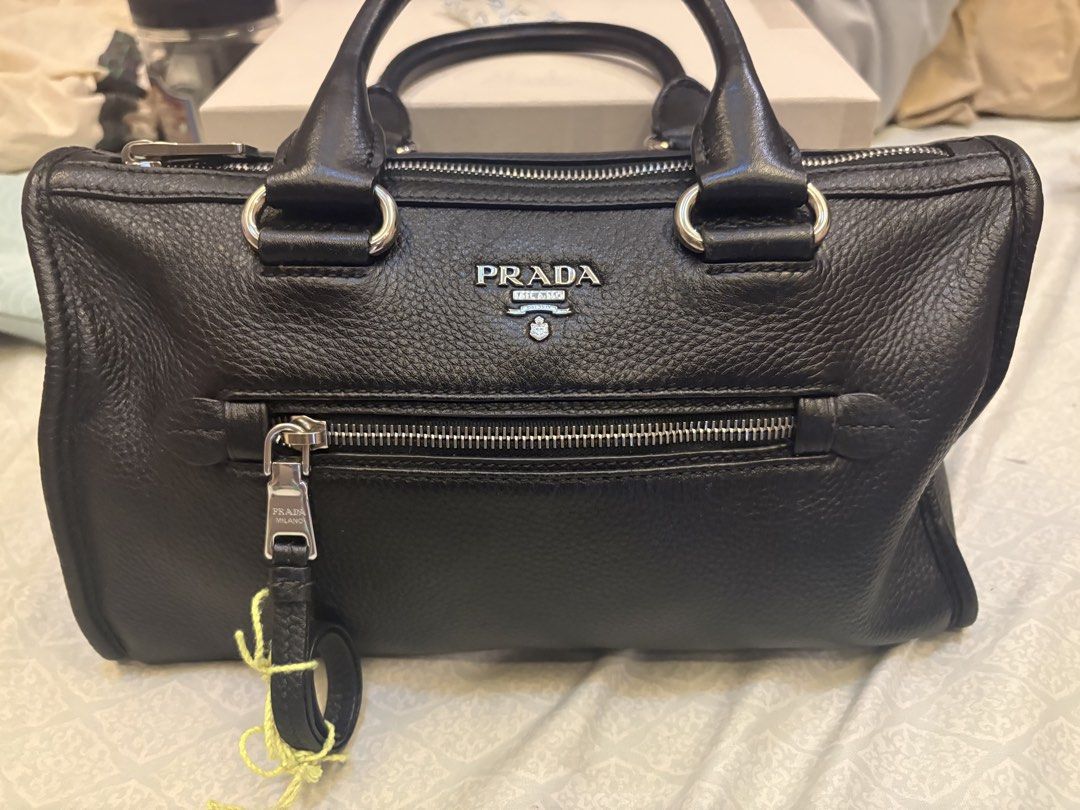 Prada Vitello Phenix leather bag small (Category: Cross-body Bags) located in Malolos. Submitted by 3Coolitz (Listing ID 1448175410, Image 1). Description: This is small size (rare size) With silver hardware With authentication With minor super small scratch pls see 8th pic Super ganda and quality leather ng Prada With long strap, pinadagdagan ko ng holes ung strap since I am a small girlie.