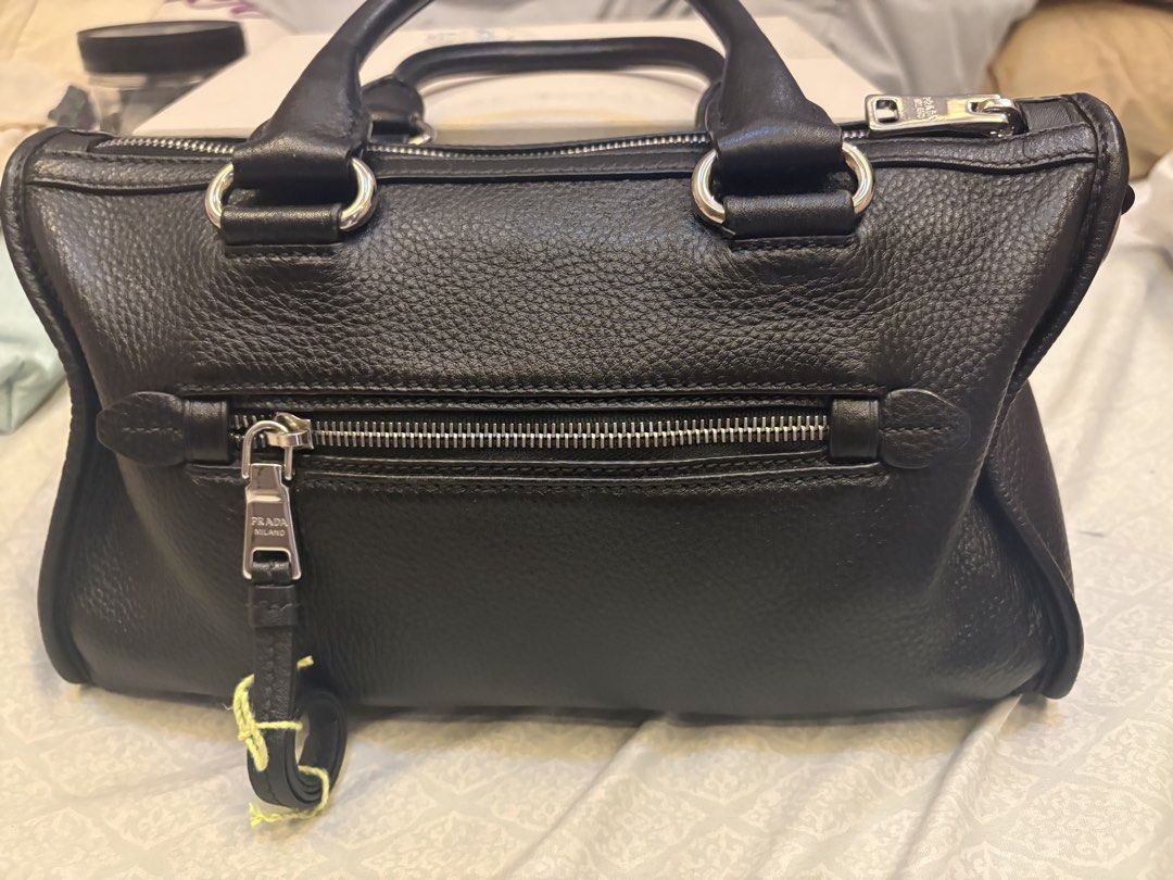 Prada Vitello Phenix leather bag small (Category: Cross-body Bags) located in Malolos. Submitted by 3Coolitz (Listing ID 1448175410, Image 2). Description: This is small size (rare size) With silver hardware With authentication With minor super small scratch pls see 8th pic Super ganda and quality leather ng Prada With long strap, pinadagdagan ko ng holes ung strap since I am a small girlie.