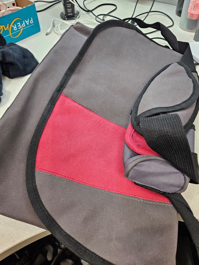 Puma Backpack (Category: Backpacks) located in Singapore. Submitted by edwinsia74 (Listing ID 1448148607, Image 2). Description: - Black Puma backpack - Large Puma logo on front - Smaller Puma logo on side - Multiple zippered compartments - Grey and pink accent on flap - Suitable for school or everyday use.