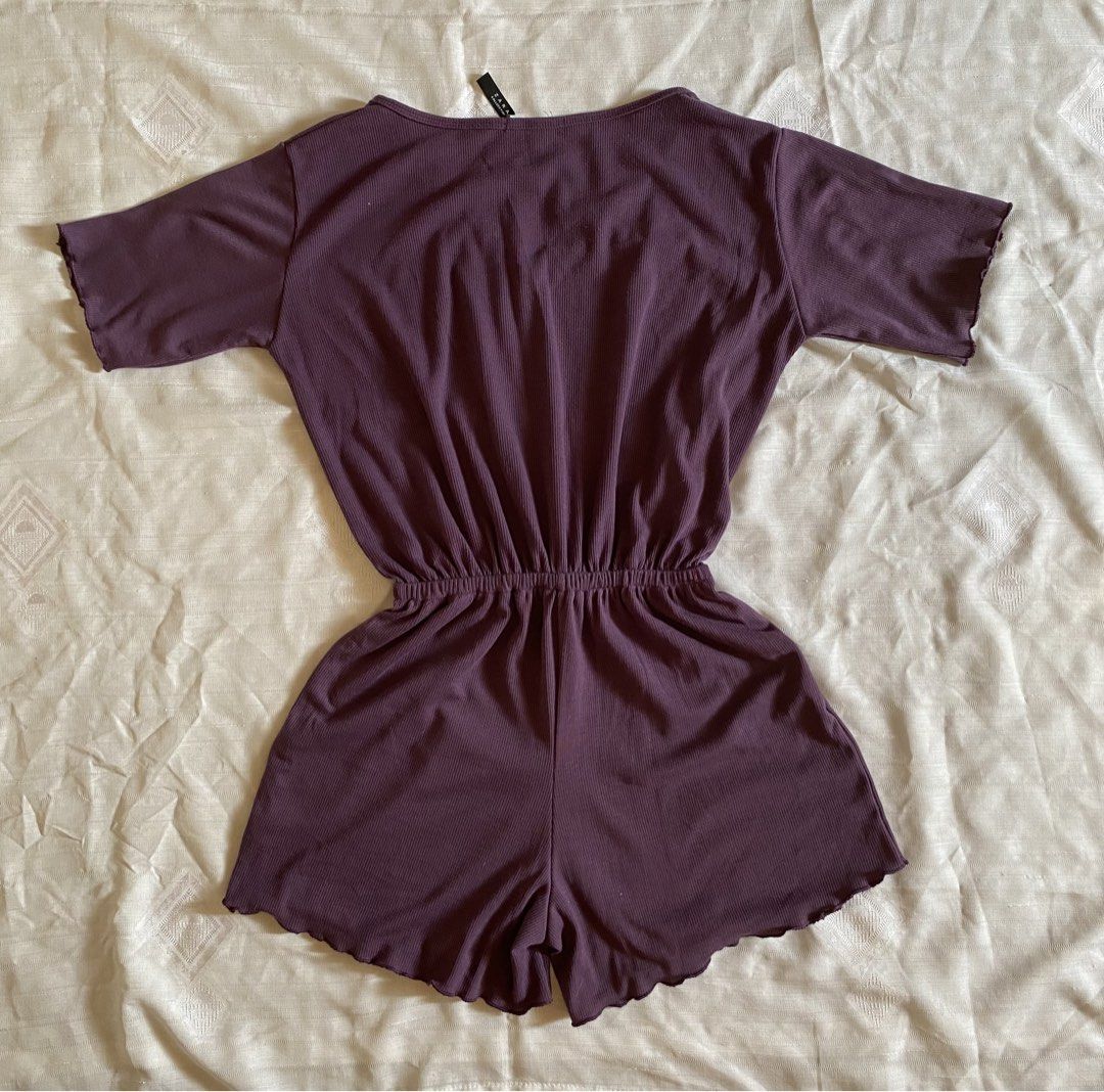 Purple Ribbed V-Neck Romper with Drawstring Waist (Category: Rompers) located in Quezon City. Submitted by hojicha.cat (Listing ID 1448149528, Image 2). Description: 🛍️Lalamove/Grab booked by buyer on the same day. ❌NO J&T and LBC booking 💜V-neck with drawstring waist 💜Short sleeves with lettuce hem 💜Lettuce hem on shorts 💜Comfortable and casual 💜Perfect for lounging or relaxed outings 💜FREE random stickers on purchase..