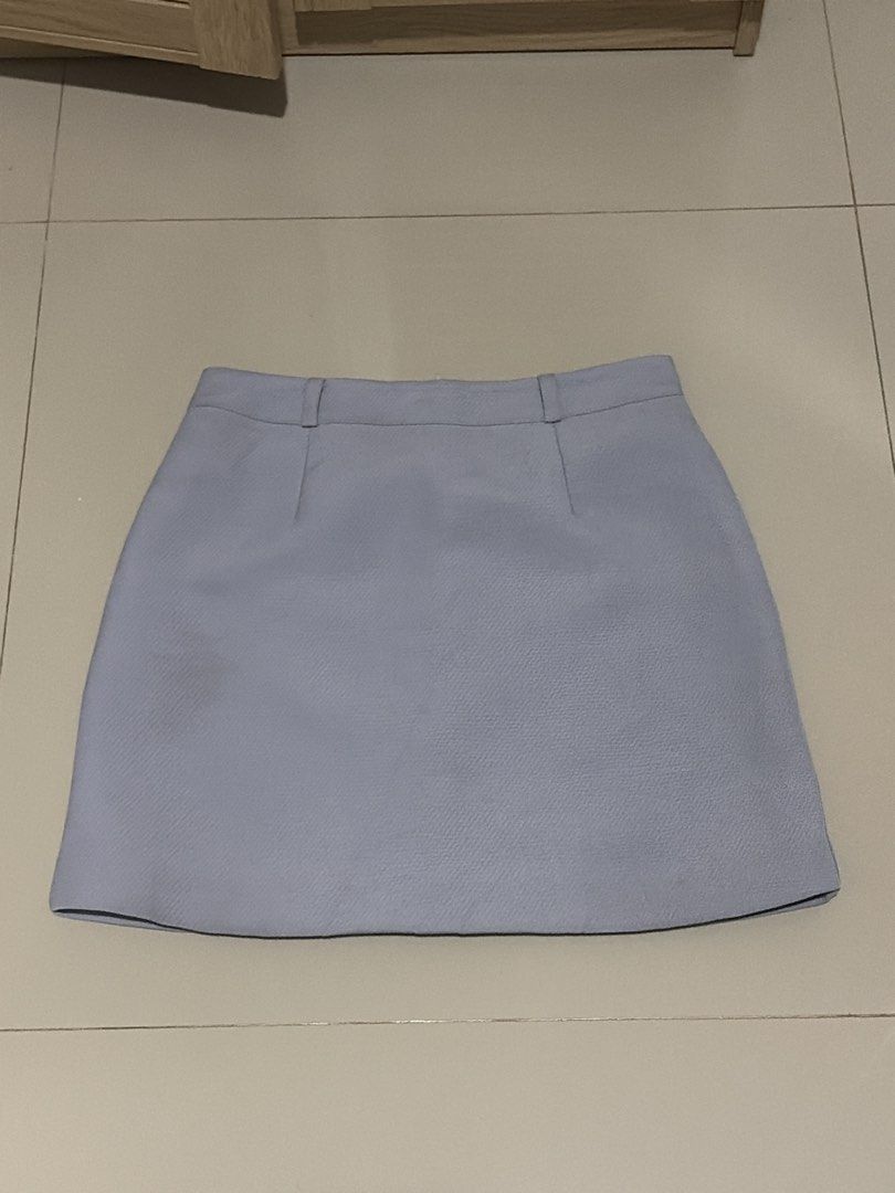 Rhus Ovata Light Blue Mini Skirt Size M (Category: Skirts) located in Angeles City. Submitted by declutterwithus (Listing ID 1448197384, Image 1). Description: - Light blue mini skirt - Brand: Rhus Ovata - Size: M - Classic and simple design - Features belt loops at the waist - Perfect for casual or dressy occasions - Easy to style with various tops.