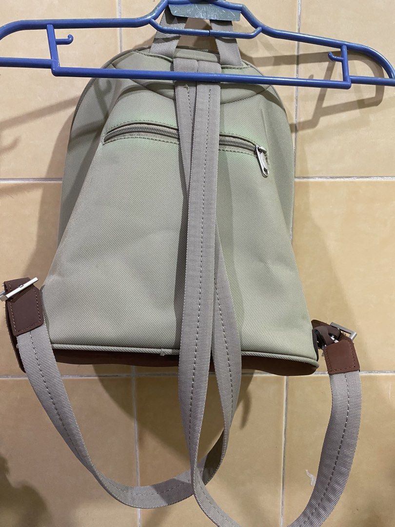 Samsonite Beige & Brown Backpack (Category: Backpacks) located in Makati City. Submitted by jdeep9 (Listing ID 1448096956, Image 2). Description: - Neutral beige and brown Samsonite backpack - Main zippered compartment - Front zippered pocket - Adjustable shoulder straps with buckle details - Durable darker brown bottom panel - Ideal for everyday use or travel.
