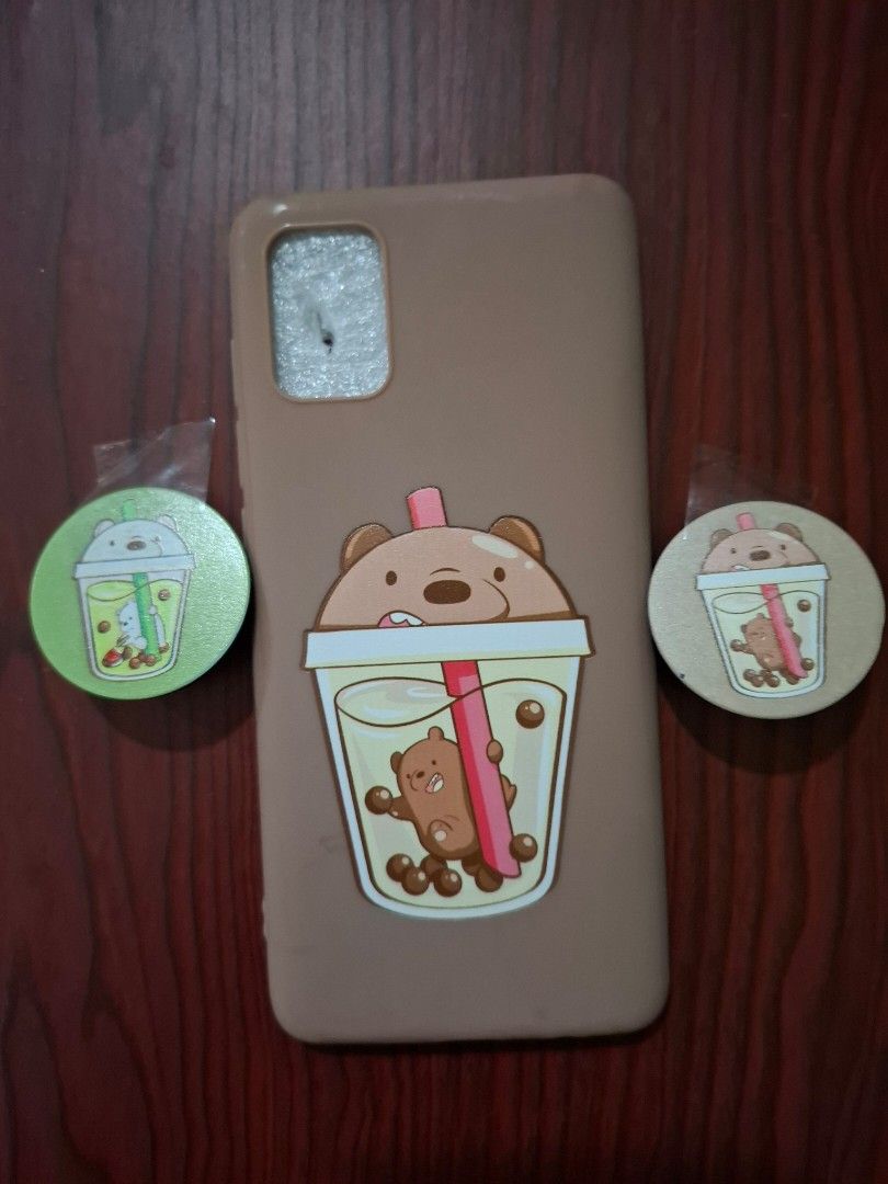 Samsung Galaxy A51 Phone Case Set (Category: Cases & Sleeves) located in Quezon City. Submitted by potaaat (Listing ID 1448250841, Image 2). Description: 📌 Original Price (Set / Never Used) - 200 📌 Open for Negotiations ( ＾▽＾) - Adorable phone case featuring a bear enjoying bubble tea. - Comes with two matching phone grips. - One grip has a green bubble tea bear, the other has a brown one. - Provides phone protection with a fun and cute aesthet