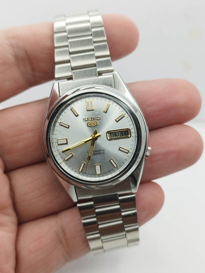 Seiko 5 automatic silver 2 (Category: Men's Watches) located in Quezon City. Submitted by WatchProject (Listing ID 1448272745, Image 2). Description: original Seiko movement 7009 stainless steel aftermarket base dial hands and strap in good running condition 37mm case dm with. box and manual.