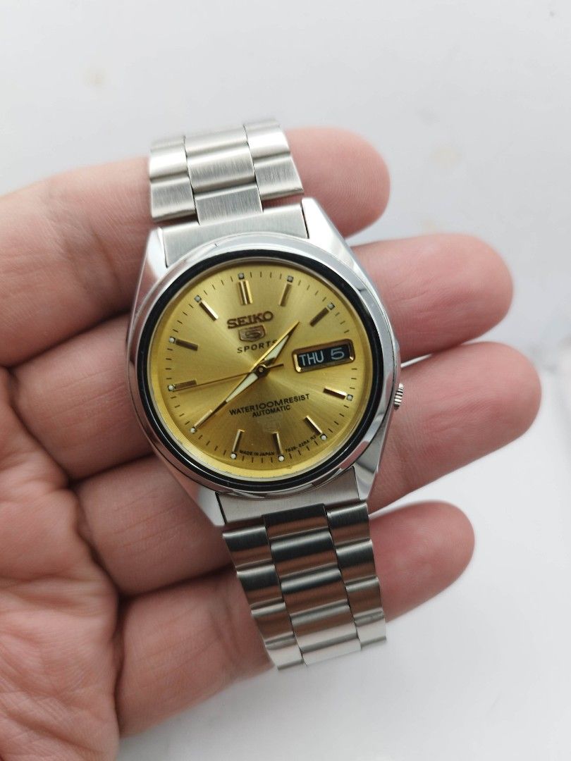 Seiko 5 automatic watch (Category: Men's Watches) located in Quezon City. Submitted by WatchProject (Listing ID 1448272688, Image 2). Description: original Seiko movement 7009 stainless steel aftermarket base dial hands and strap in good running condition 37mm case dm with. box and manual.