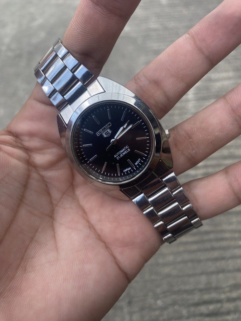 Seiko 5 Black Dial Watch (Category: Men's Watches) located in Manila. Submitted by thrifttodays. (Listing ID 1448188295, Image 1). Description: - Seiko 5 Watch - Black Dial with Silver Hands & Markers - Durable Stainless Steel Bracelet - Water Resistant - Ideal Everyday Watch.