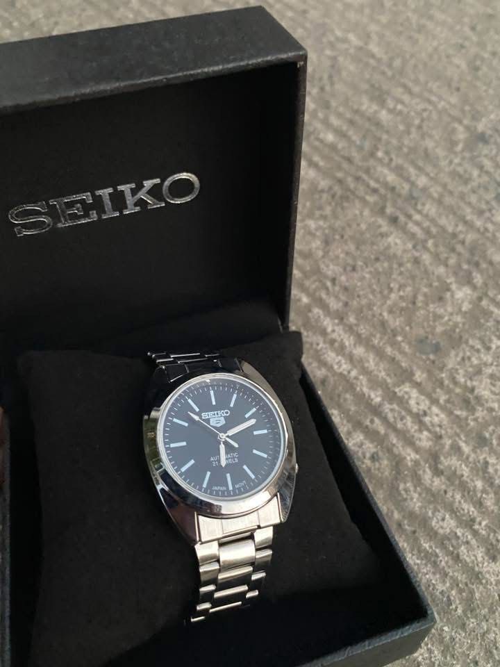 Seiko 5 Black Dial Watch (Category: Men's Watches) located in Manila. Submitted by thrifttodays. (Listing ID 1448188295, Image 3). Description: - Seiko 5 Watch - Black Dial with Silver Hands & Markers - Durable Stainless Steel Bracelet - Water Resistant - Ideal Everyday Watch.