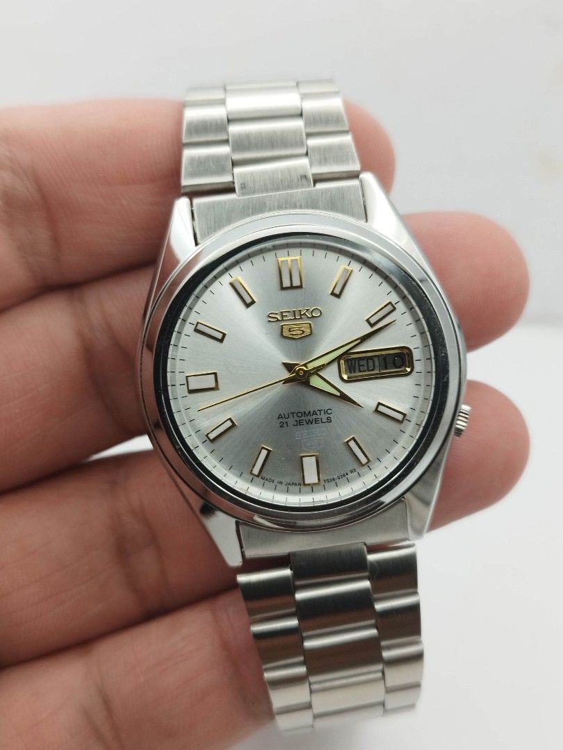 Seiko 5 silver dial (Category: Men's Watches) located in Quezon City. Submitted by WatchProject (Listing ID 1448272728, Image 2). Description: original Seiko movement 7009 stainless steel aftermarket base dial hands and strap in good running condition 37mm case dm with. box and manual.
