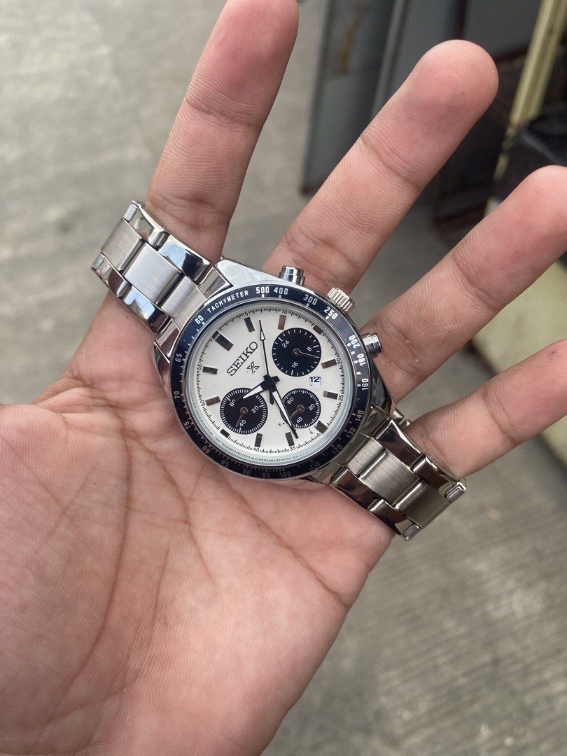 Seiko Chronograph Tachymeter Automatic Watch (Category: Men's Watches) located in Manila. Submitted by thrifttodays. (Listing ID 1448187804, Image 1). Description: - Seiko Automatic Movement Chronograph Watch - Classic white dial with black sub-dials - Functional tachymeter bezel - Durable stainless steel bracelet - Automatic movement visible through case back - Comes with original box and paper bag - Ideal for watch collectors and enthusiasts.