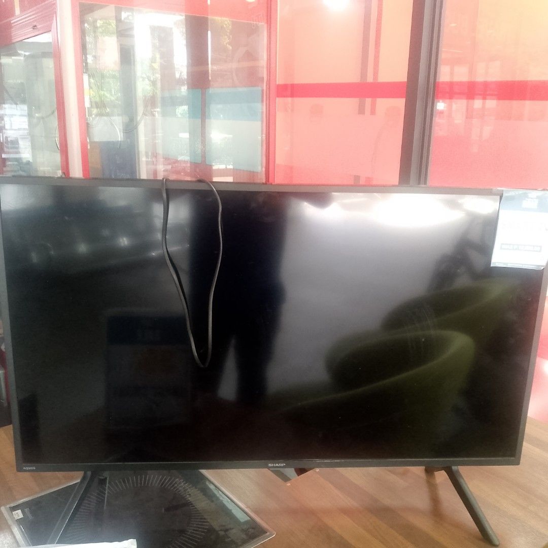 Sharp TV (Category: TV) located in Manila. Submitted by cleverwolf.07545a (Listing ID 1448088156, Image 1). Description: - Sharp TV - Black screen with stand - Power cord included - Works well - Perfect for your entertainment needs.