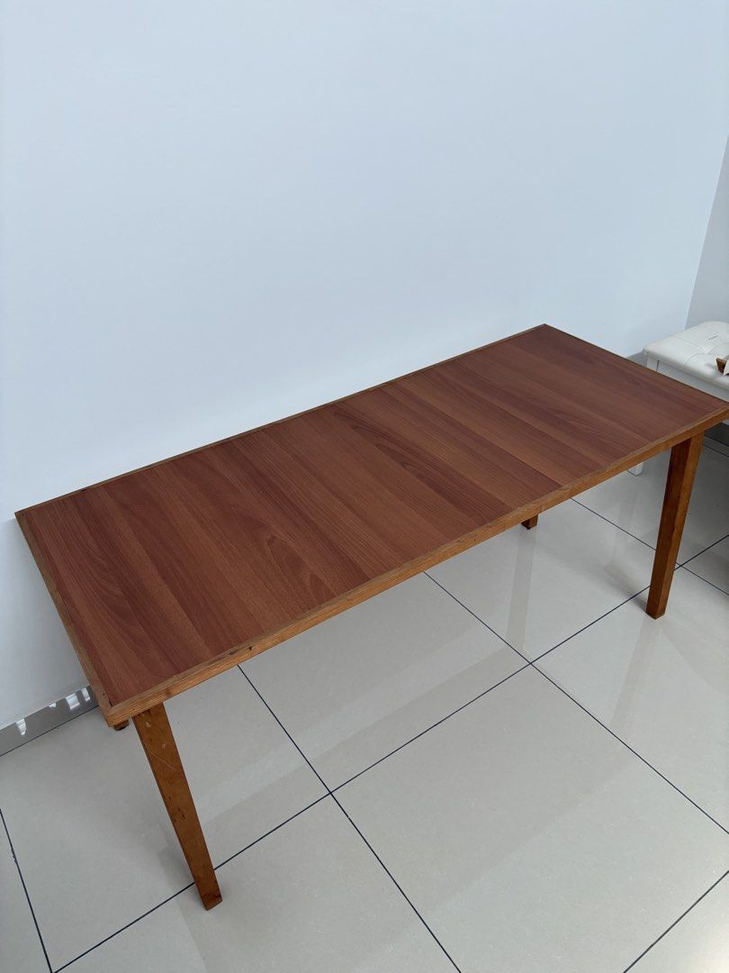 Solid wood study / working table (Category: Tables & Sets) located in Johor Bahru. Submitted by happimation (Listing ID 1448182874, Image 1). Description: - in good condition - custom made solid wood - with table leg risers (x 4) - height 64 cm ; length 140cm ; width 58cm - total height with leg risers 72cm Delivery within JB area / self pickup.