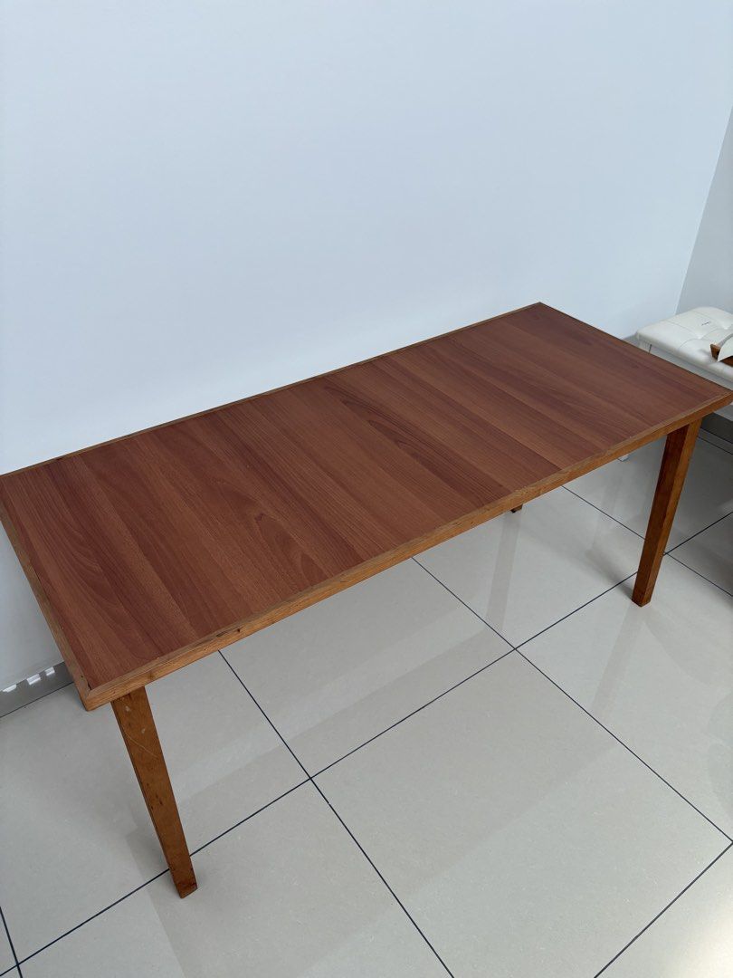 Solid wood study / working table (Category: Tables & Sets) located in Johor Bahru. Submitted by happimation (Listing ID 1448182874, Image 3). Description: - in good condition - custom made solid wood - with table leg risers (x 4) - height 64 cm ; length 140cm ; width 58cm - total height with leg risers 72cm Delivery within JB area / self pickup.