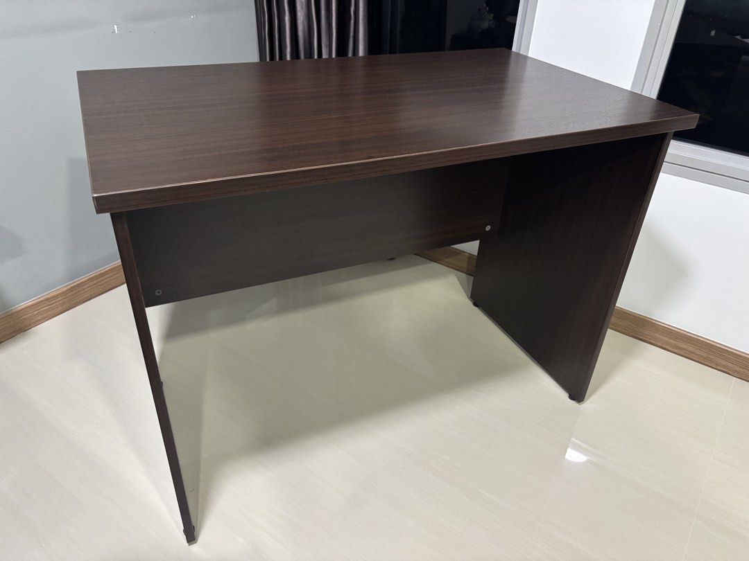 Solid Wood Study Table (Category: Tables & Sets) located in Singapore. Submitted by kopi_ohh (Listing ID 1448242391, Image 2). Description: Moving out sale Still in very good condition 100cm/L x 60cm/W x 75cm/H Pls arrange your own transport .