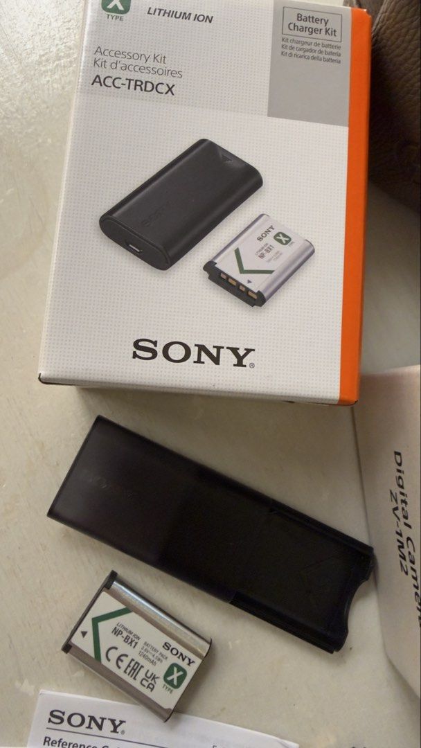 Sony ZV-1M2 Digital Camera with Accessories (Category: Cameras) located in Quezon City. Submitted by kellypochette (Listing ID 1448098168, Image 3). Description: - Sony ZV-1M2 Digital Camera - Ideal for Vlogging & Travel - Includes Original Box - Charger Kit (ACC-TRDCX) - Two (2) NP-BX1 Batteries - SanDisk 128GB Extreme SD Card - USB Cable - Grey Leather Pouch Complete set—usually you have to buy the charger, memory card, and extra battery separa
