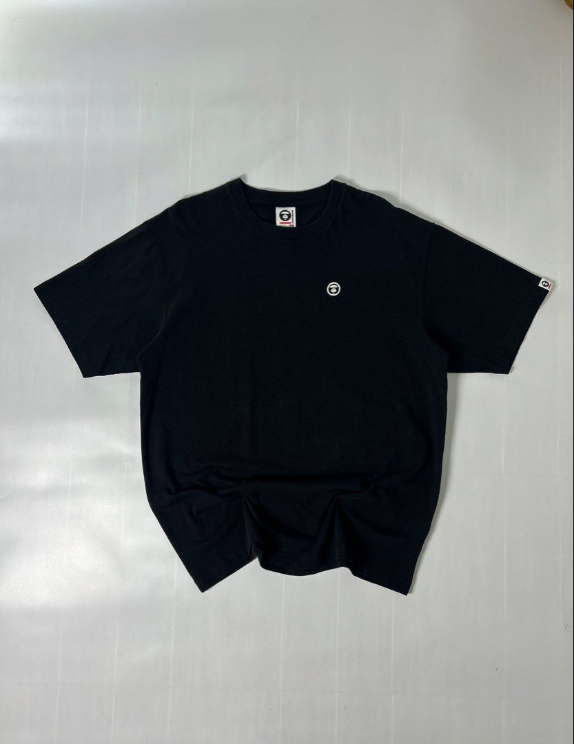 T shirt (Category: Activewear) located in Manila. Submitted by thriftforlifeest2025 (Listing ID 1448111293, Image 1). Description: Aape by A Bathing Ape small embroidered logo on the chest. Size: Xxl Width: 23 Length: 30.5 9/10 Condition ₱800.