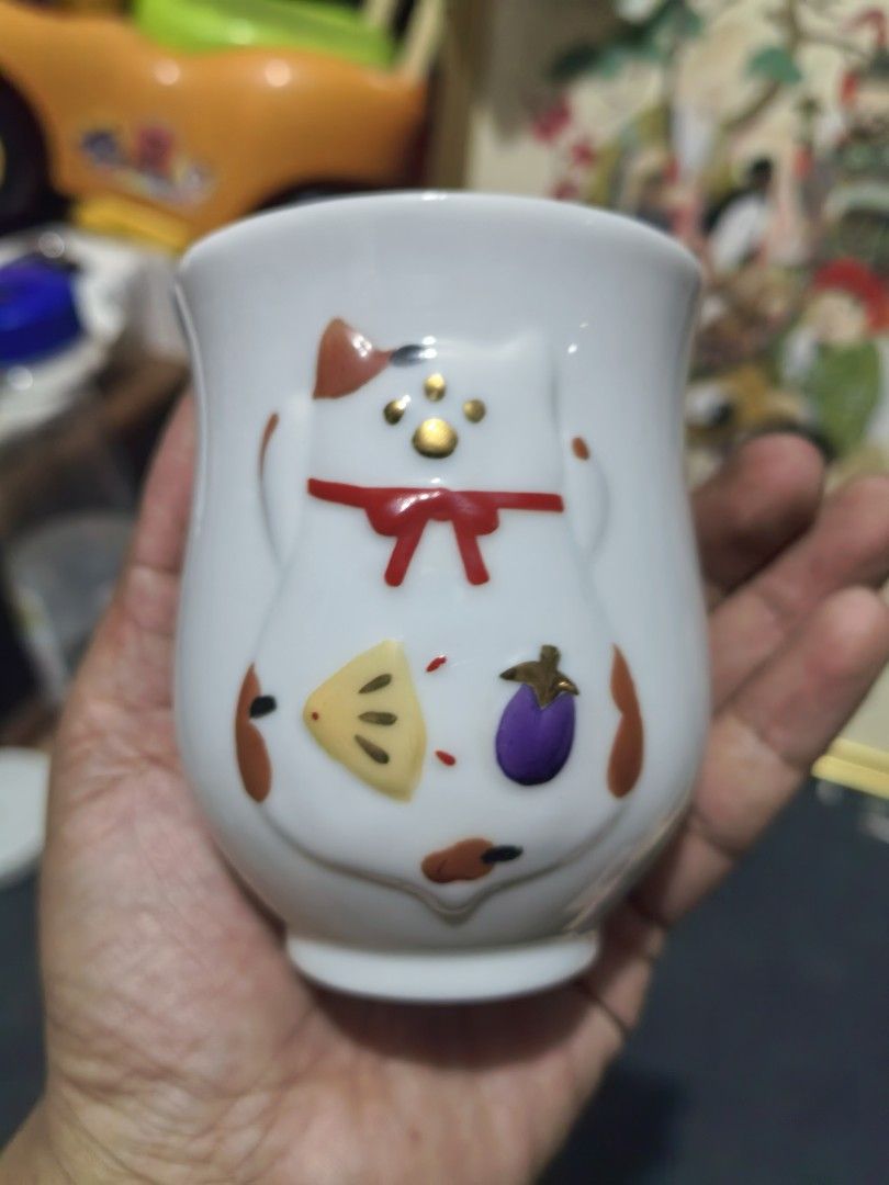 Teacups - Japanese Yunomi-style Ceramic Cup - Pair (Category: Coffee & Tea Tableware) located in Cebu City. Submitted by dudes_villanueva (Listing ID 1448133404, Image 3). Description: Teacups - Japanese Yunomi-style Ceramic Cup - Pair 📌 Features a raised, three-dimensional maneki-neko (lucky cat) design with gold-painted accents.. Big : Height - 3.75 in Small : Height - 3.10 in.