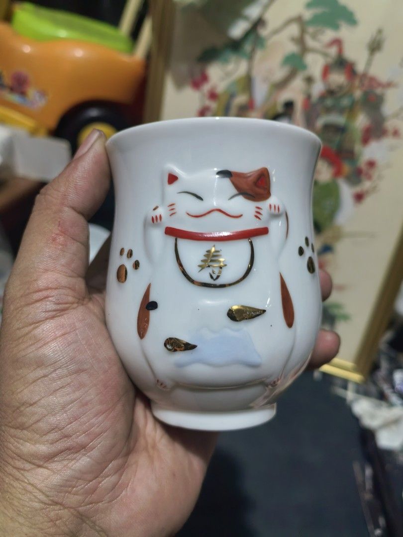 Teacups - Japanese Yunomi-style Ceramic Cup - Pair (Category: Coffee & Tea Tableware) located in Cebu City. Submitted by dudes_villanueva (Listing ID 1448133404, Image 2). Description: Teacups - Japanese Yunomi-style Ceramic Cup - Pair 📌 Features a raised, three-dimensional maneki-neko (lucky cat) design with gold-painted accents.. Big : Height - 3.75 in Small : Height - 3.10 in.