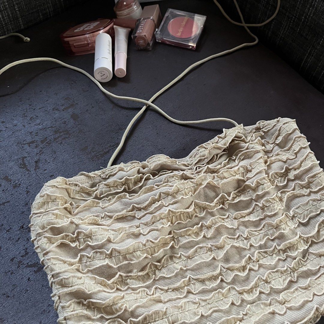 Textured Tube Top with Tie Straps (Category: Sleeveless) located in Marikina City. Submitted by adiprelovedd (Listing ID 1448129695, Image 2). Description: - Cream colored tube top - Textured lace material - Adjustable tie neck straps - Super cute and unique design - Perfect for beach days or nights out - Pairs well with jeans or skirts.