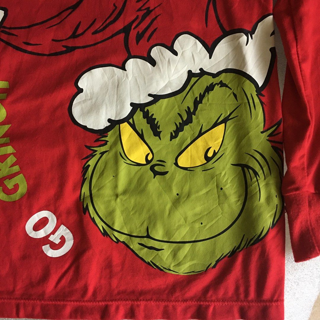 The Grinch Dr. Seuss Shirt (Category: Everything Else Others) located in Tarlac. Submitted by greatfindstrlc (Listing ID 1448104280, Image 2). Description: TM 2024 Dr. Suess Enterprises bright red Polyester long sleeves shirt. Medium (8-10) Chest: 20” Length: 26”, good condition just needs to be washed well. Made in China.