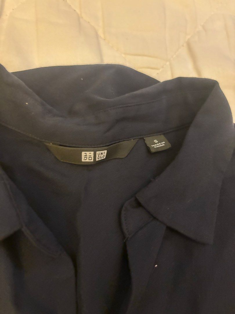 Uniqlo Navy Blue Collared Shirt Size S (Category: Shirts) located in Angono. Submitted by andyyyyyy__ (Listing ID 1448184020, Image 2). Description: - Uniqlo Collared Shirt - Color: Navy Blue - Size: S - Fit: Relaxed - Sleeves: 3/4 length - Style: Simple and versatile - Occasion: Perfect for casual outings or work attire - Pairing: Easily matches with various bottoms.