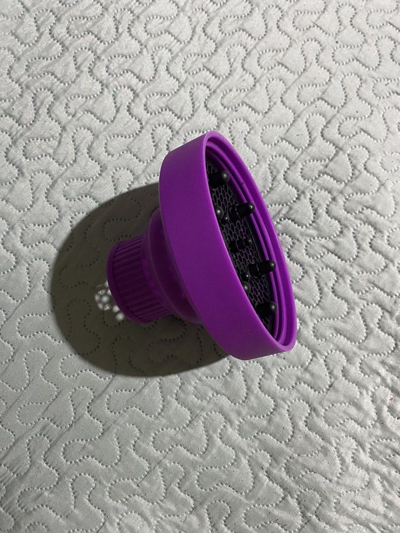Universal Silicone Hair Dryer Diffuser Attachment (Category: Hair) located in Makati City. Submitted by stashionista (Listing ID 1448199279, Image 3). Description: - Purple silicone hair dryer diffuser - Fits most standard hair dryers - Distributes air evenly for faster, better drying - Ideal for enhancing curly or wavy hair - Folds flat for convenient storage and travel - Achieve voluminous curls with less frizz.