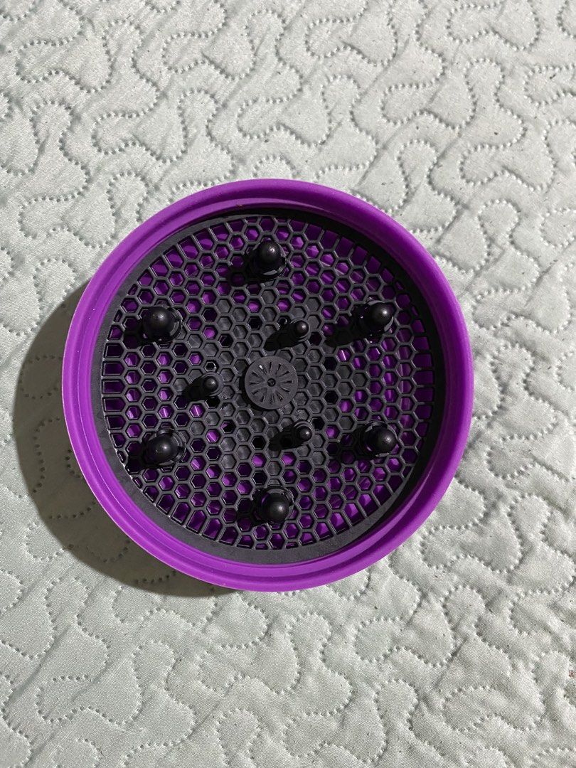 Universal Silicone Hair Dryer Diffuser Attachment (Category: Hair) located in Makati City. Submitted by stashionista (Listing ID 1448199279, Image 1). Description: - Purple silicone hair dryer diffuser - Fits most standard hair dryers - Distributes air evenly for faster, better drying - Ideal for enhancing curly or wavy hair - Folds flat for convenient storage and travel - Achieve voluminous curls with less frizz.