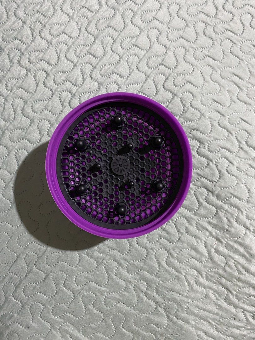 Universal Silicone Hair Dryer Diffuser Attachment (Category: Hair) located in Makati City. Submitted by stashionista (Listing ID 1448199279, Image 2). Description: - Purple silicone hair dryer diffuser - Fits most standard hair dryers - Distributes air evenly for faster, better drying - Ideal for enhancing curly or wavy hair - Folds flat for convenient storage and travel - Achieve voluminous curls with less frizz.