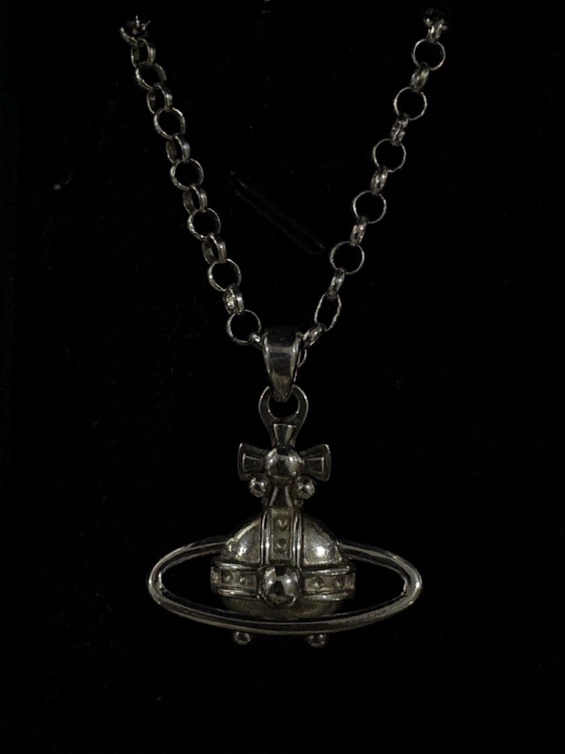 Vivienne Westwood Orb Silver Necklace (Category: Necklaces) located in Paranaque City. Submitted by cur8dfinds (Listing ID 1448175541, Image 1). Description: TAKE NOTE THAT THIS PIECE IS CUSTOM MADE / NOT LEGIT - Material: Silver 925 - Chain length: 20in - Pendant: 5.1g - Chain: 8.1g - Barely used - Needs a bit cleaning INCLUSIONS - Box - 3pcs of Silver polishing cloth cleaner.