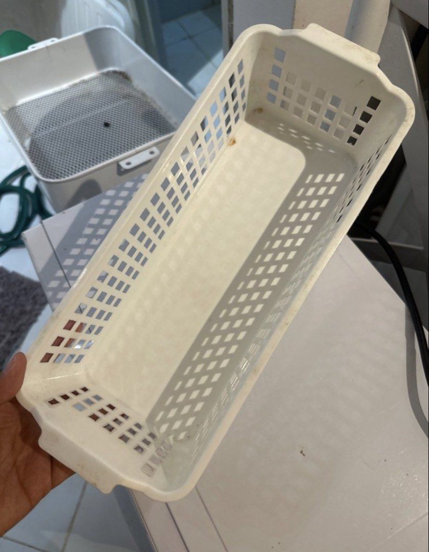 White Plastic Storage Baskets (Set of 2) (Category: Storage Boxes & Baskets) located in Quezon City. Submitted by trisssh0 (Listing ID 1448090896, Image 2). Description: - Set of 2 white plastic storage baskets - Features a stylish perforated design - Convenient side handles for easy carrying - Versatile for organizing shelves, drawers, and countertops - Suitable for kitchen, bathroom, or office use - Great for storing small items.