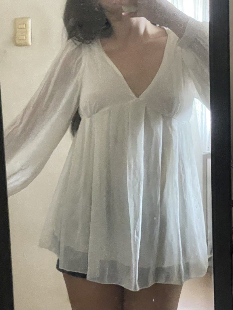 White Sheer Dress (Category: Dresses) located in Manila. Submitted by declutteredbyalex (Listing ID 1448197663, Image 2). Description: - Sheer dress. Sleeves are completely see through while the fabric for the body is double lining - Presko to wear and flowy - Best to wear with light colored mini skirts or shorts - All the actual photos are already posted RFS: Decluttering.