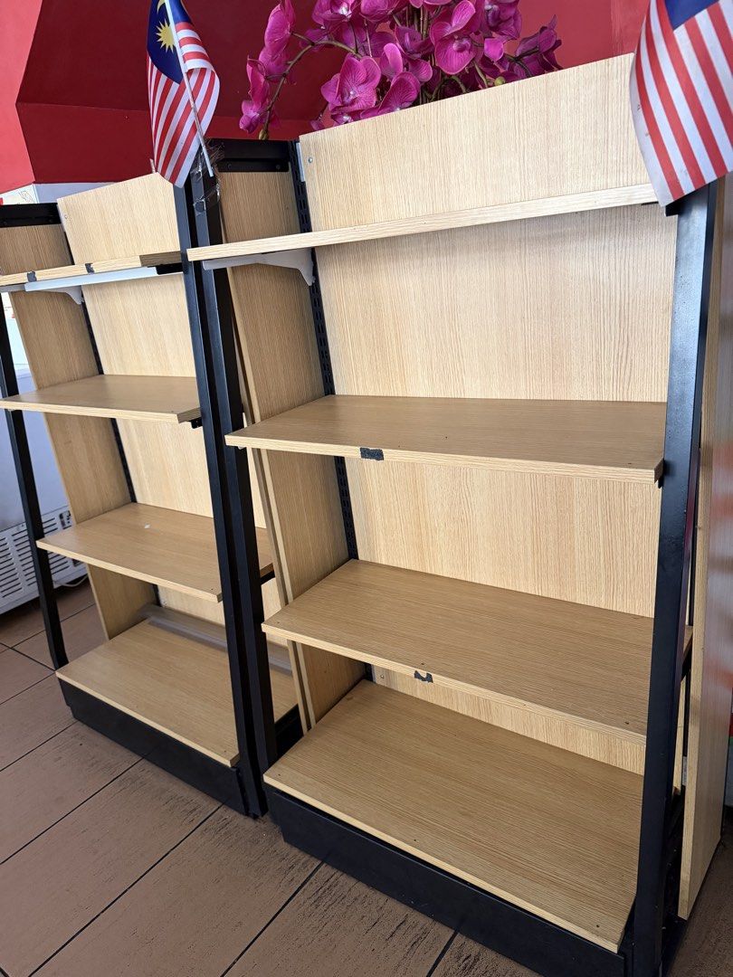 Wooden Shelving Unit with Black Frame (Category: Shelves, Cabinets & Racks) located in Petaling Jaya. Submitted by puteri.a (Listing ID 1448137896, Image 1). Description: - Sturdy wooden shelving unit - Black metal frame - Multiple shelves for display or storage - Features a light wood grain pattern - Ready for a new home.