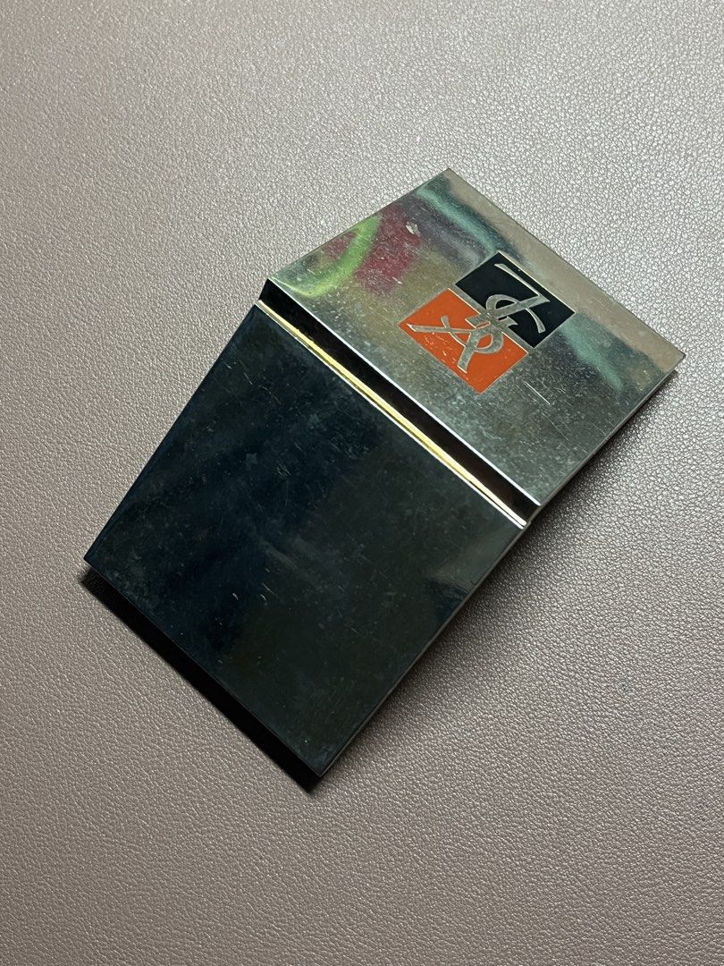 Yves Saint Laurent YSL Vintage Compact Mirror Case (Category: Makeup) located in Manila. Submitted by carmiscloset (Listing ID 1448262796, Image 3). Description: - Vintage YSL compact case - Silver tone with iconic YSL logo - Mirror inside is intact - Some signs of wear on exterior metal casing - Closes securely - Classic makeup accessory.