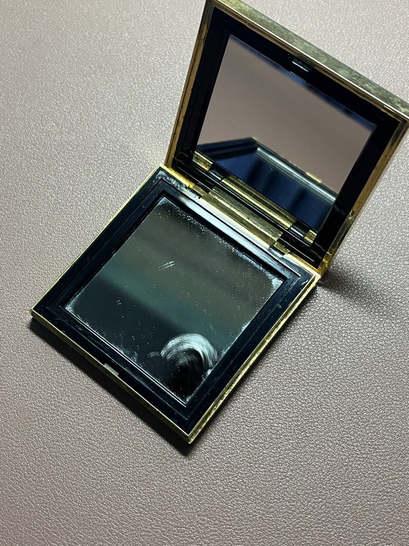 Yves Saint Laurent YSL Vintage Compact Mirror Case (Category: Makeup) located in Manila. Submitted by carmiscloset (Listing ID 1448262796, Image 2). Description: - Vintage YSL compact case - Silver tone with iconic YSL logo - Mirror inside is intact - Some signs of wear on exterior metal casing - Closes securely - Classic makeup accessory.
