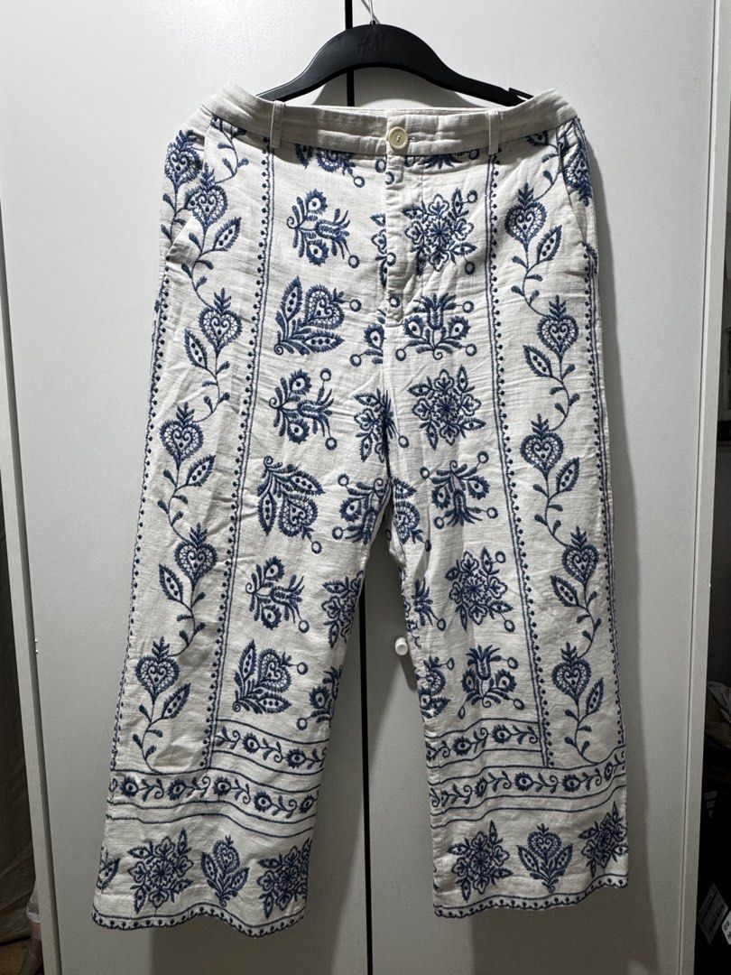 ZARA Embroidered Cropped Pants Size M (Category: Jeans) located in Quezon City. Submitted by mateyyy_ (Listing ID 1448129949, Image 2). Description: - White cropped pants - Features delicate blue embroidery - Button and zip closure - Convenient front pockets - Made in Cambodia - Size M - Ideal for casual wear.