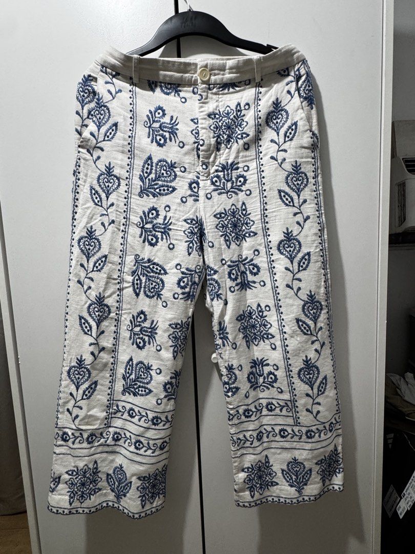 ZARA Embroidered Cropped Pants Size M (Category: Jeans) located in Quezon City. Submitted by mateyyy_ (Listing ID 1448129949, Image 1). Description: - White cropped pants - Features delicate blue embroidery - Button and zip closure - Convenient front pockets - Made in Cambodia - Size M - Ideal for casual wear.