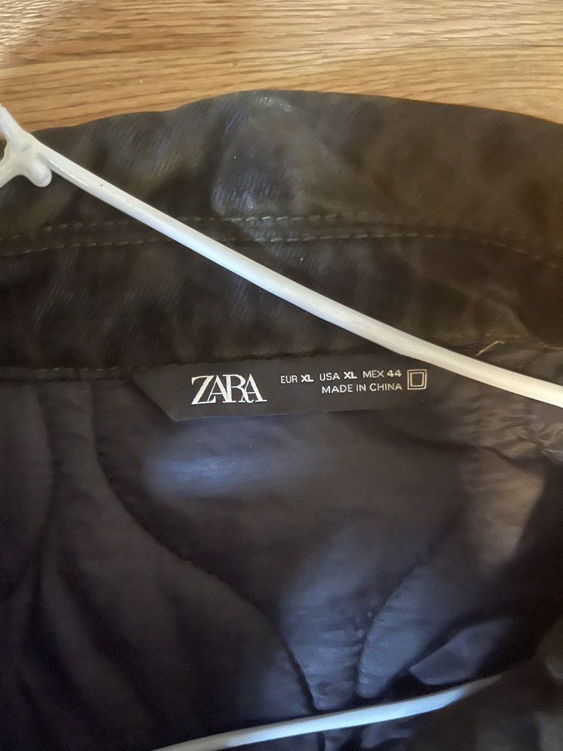 ZARA Men's Dark Grey Utility Jacket (Category: Coats, Jackets and Outerwear) located in Quezon City. Submitted by aaapanda1131221 (Listing ID 1448275531, Image 3). Description: - ZARA Dark Grey Utility Jacket - Zip and button closure - Multiple front pockets - Durable material - Ideal for everyday wear or outdoor activities.